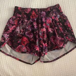 Lululemon size 4 pink, purple and black flower shorts.